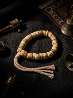 Tibetan Heritage · Irregular Prayer Wheel Old Camel Bone Mani Bead Bracelet